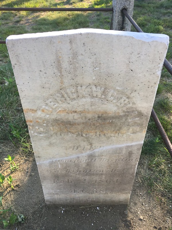 old weathered marble head stone