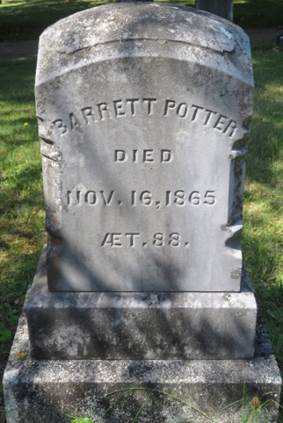 Barrett Potter's marble grave marker with rounded top and carved sides sitting on a double granite rectangular base