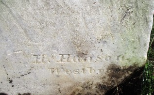 detail of an old marble gravestone carved with H. Hanson, Westbrook