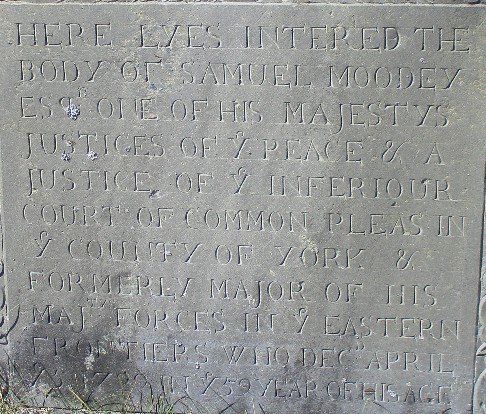 Slate stone with carved lettering transcribed in text of this document