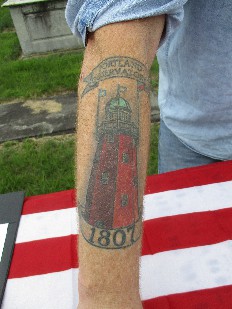 Portland Observatory tattooed on the arm of a person